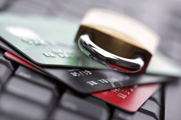 lock and credit cards on computer keyboard
