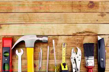 tools lined up on wood surface
