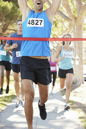 runner crossing the finish line