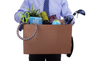 businessman holding box of stuff from his desk