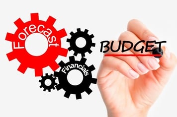 hand writing the word budget next to gears