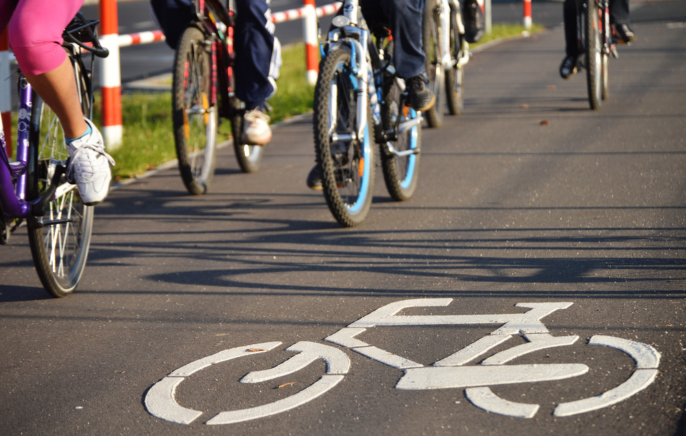 bikes and bike road sign on asphalt