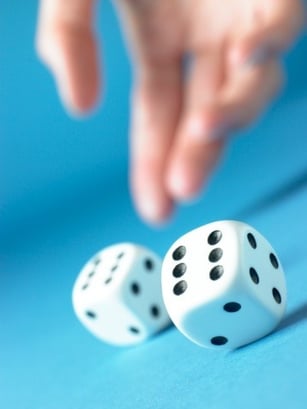 hand rolling dice