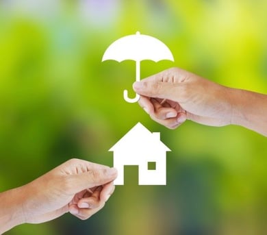 hands_holding_paper_umbrella_over_paper_house