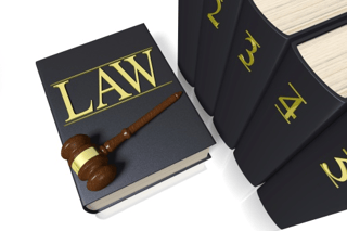 Law book with gavel on top