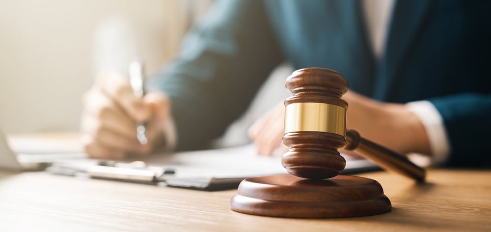 lawyer with clipboard and gavel