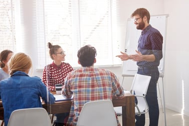 man-presenting-at-a-meeting