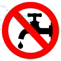 dripping water faucet with red circle and slash