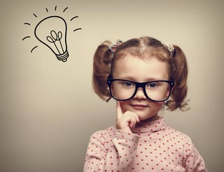 little girl thinking with light bulb above her head