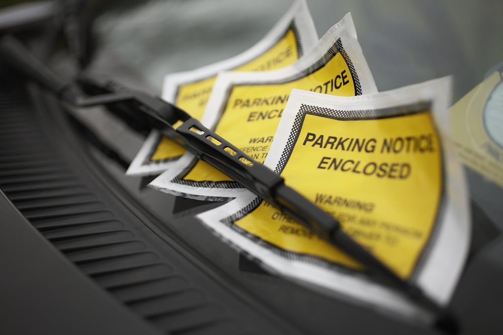 yellow parking notice on windshield